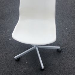 Off-white plastic IKEA desk chair