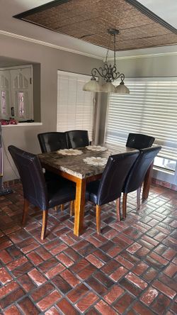 Rectangular wood dinning table with marble top. (6 chairs)