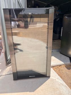Wine Enthusiast single-zone wine cooler/wine refrigerator with: 	•	Stainless steel trim 	•	Smoked glass door 	•	Exterior touch controls with a digital