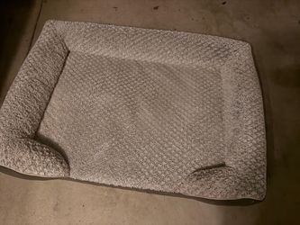 XL Plush dog bed has a grey faux fur sleeping surface