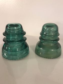 Hemingray 40 and 42 insulators with drip bottoms.
