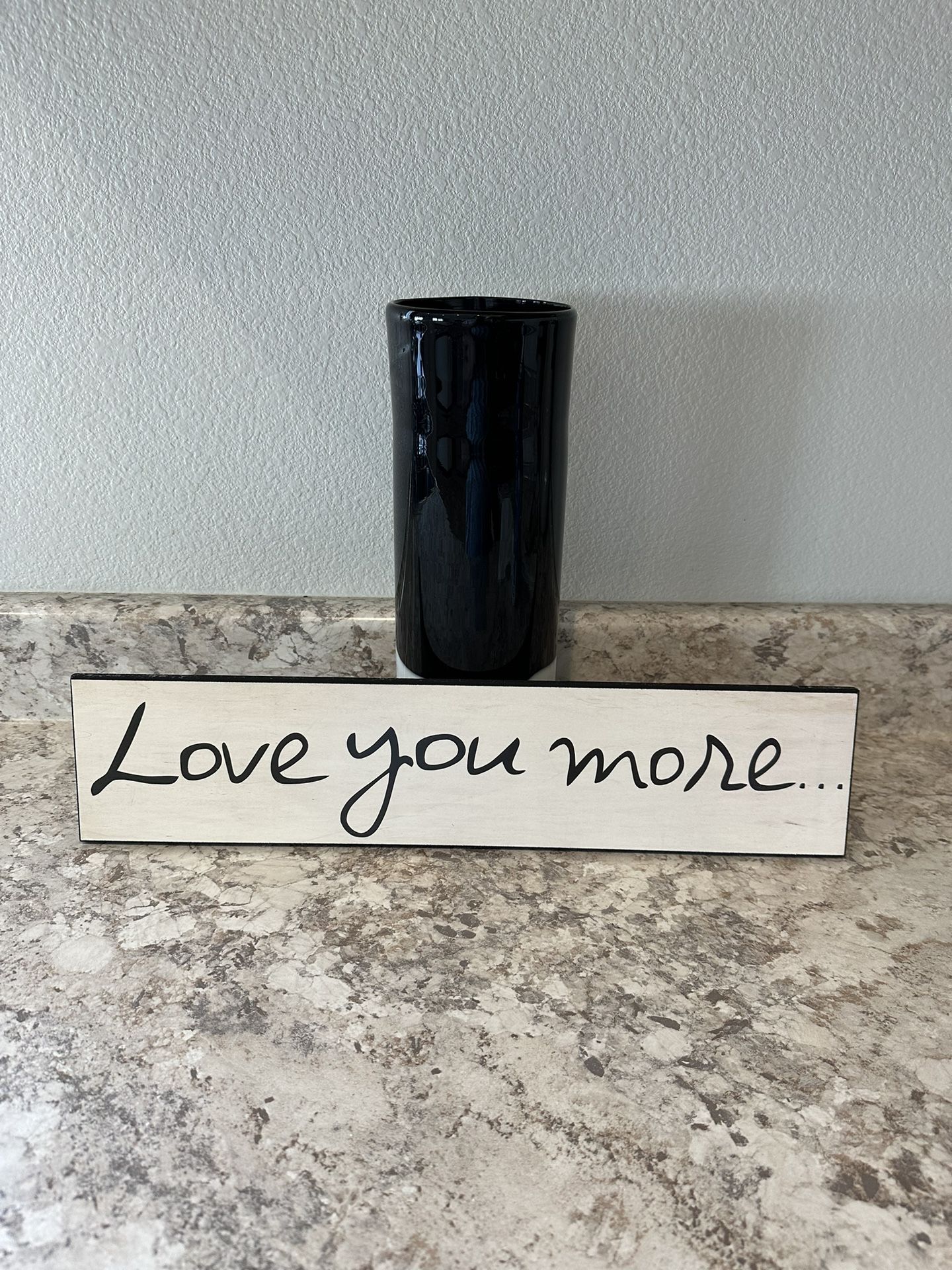 Love You More Sign And Black Vase