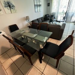 Glass table with wooden chairs