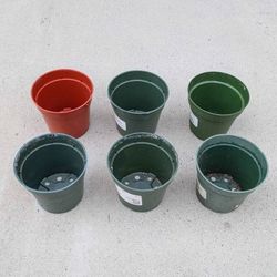 Six 4" hard plastic seed starting plant pots for indoor or outdoor seeding
