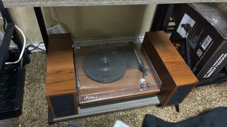 Record player with speakers and vinyl cleaner