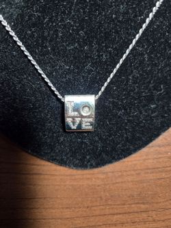 LADIES 18KT LOVE PENDANT AND 14KT DIAMOND CUT ROPE CHAIN