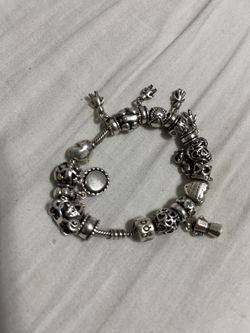 Beautiful collection Pandora sterling silver bracelet with limited edition charms over 19 charms on it authentic 