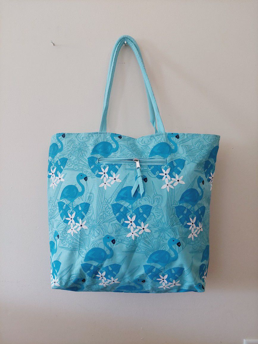 16"×18" Flamingos and Flowers Aqua Blue Teal Canvas Polyester Beach School Book Tote Shoulder Bag with One exterior and one interior zippered pockets.