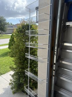 High shelf made of plastic-coated metal, 72” high, 18. 1/2” wide (8” high between each shelf). In new condition.