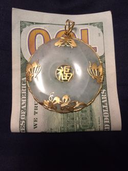 Jade and gold pendant