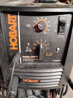 Hobart Handler 210MVP Wire Feed Welder with hose lines for gas hookup, with or without cart, extra spool of wire