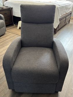Grey manual recliner  (27.5"W x 34"D x 39.5"H)