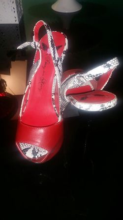 Penny lovs tommy red and snake skin high heels...size 7....great condition!