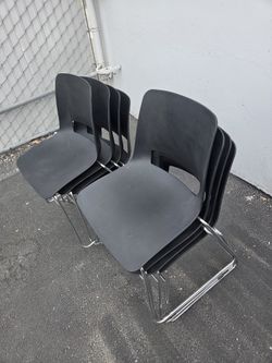 8 Stackable Plastic Chairs
