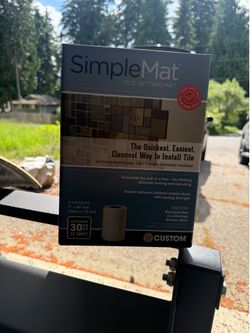 Adhesive tile mat