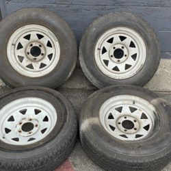 Wagon wheel style 14-inch steel wheels with old tires 5 on 4.5 lugs ford, Toyota, trailer