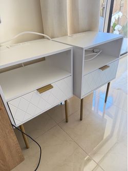 White nightstands with charging stations