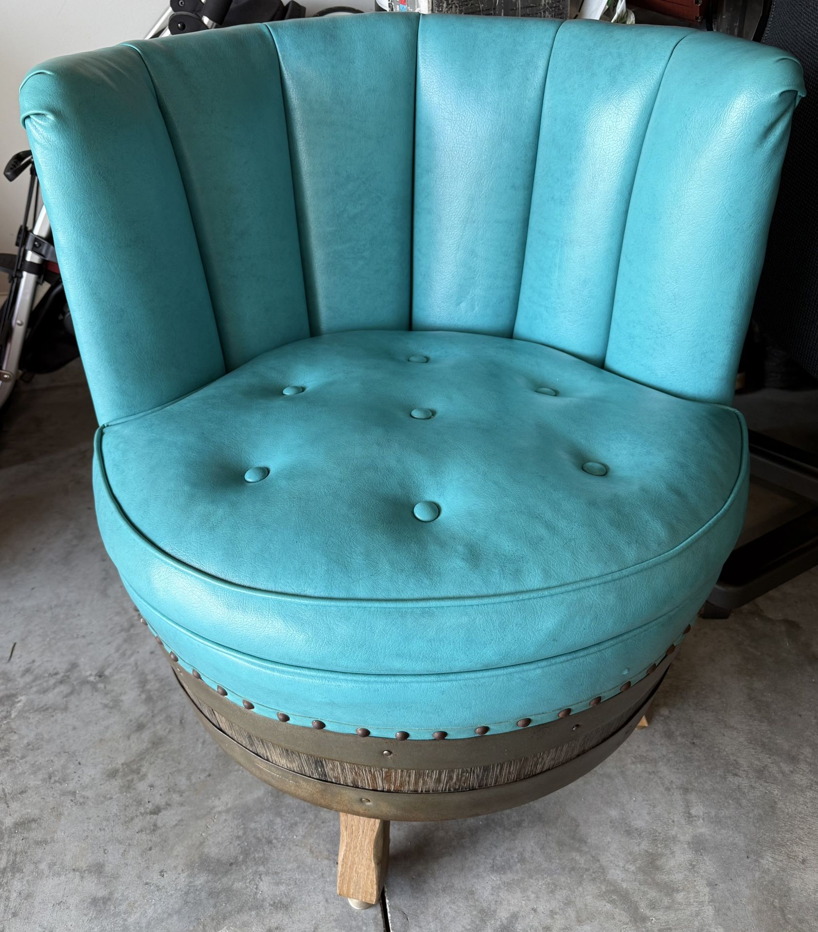 Leather swiveling barrel chair