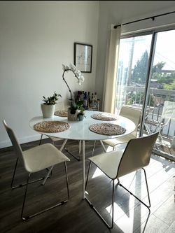 White CB2 Dining Table with 4 chairs