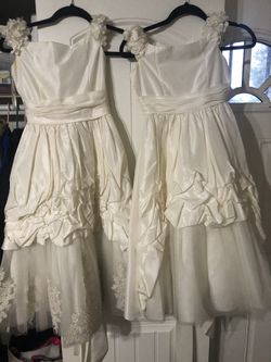 2 flower dress ,size 10 (used) and 7(new) $25
