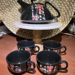 Tea Set.  Includes a tea pot  and 4 cups.  Traditional oriental cups . Black