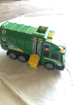 Garbage Truck. Lights up. Sounds moving parts.