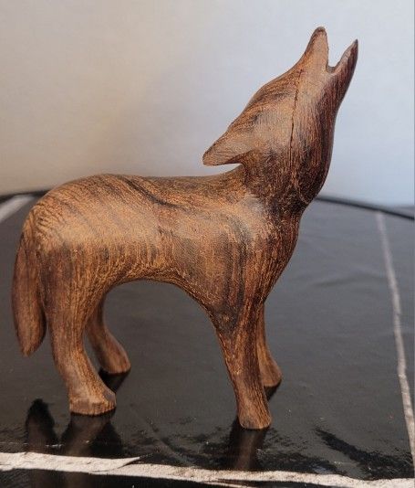 Wood Carved Wolf Howling At The Moon