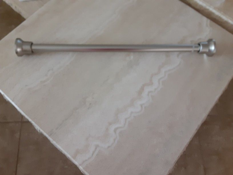 Spring Tension Curtain Rod.