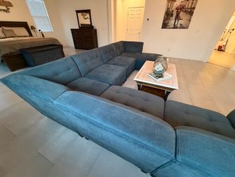 Large teal-green Tufted Sectional Sofa