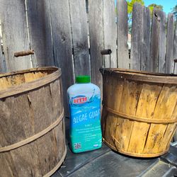 Two wooden bushel baskets and algae guard together only 10$. All