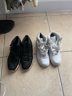 Two Pairs of Nike High-Top Sneakers