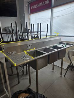 Elkay 3 compartment sink with drain boards.