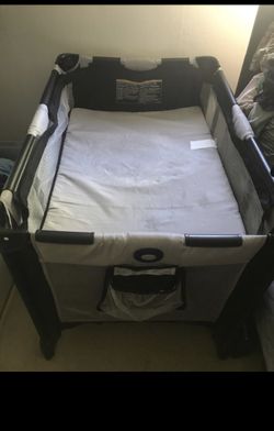 Never before used baby crib / play pen / diaper changer