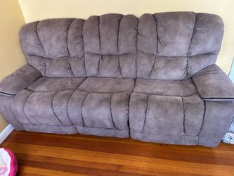 Reclining couch, fireplace and coffee table