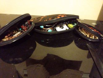 3 matching clutch bags full of jewelry