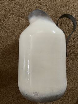 Concrete vase pitcher jug with metal handle.