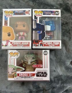 FUNKO POP LOT, HE-MAN, TRANSFORMER OPTIMUS PRIME, STAR WARS GROGU