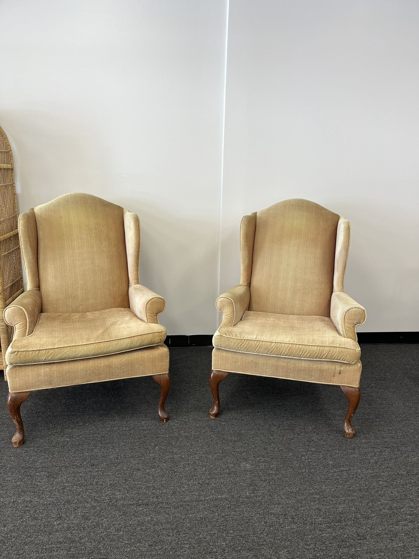 two gold statement chairs