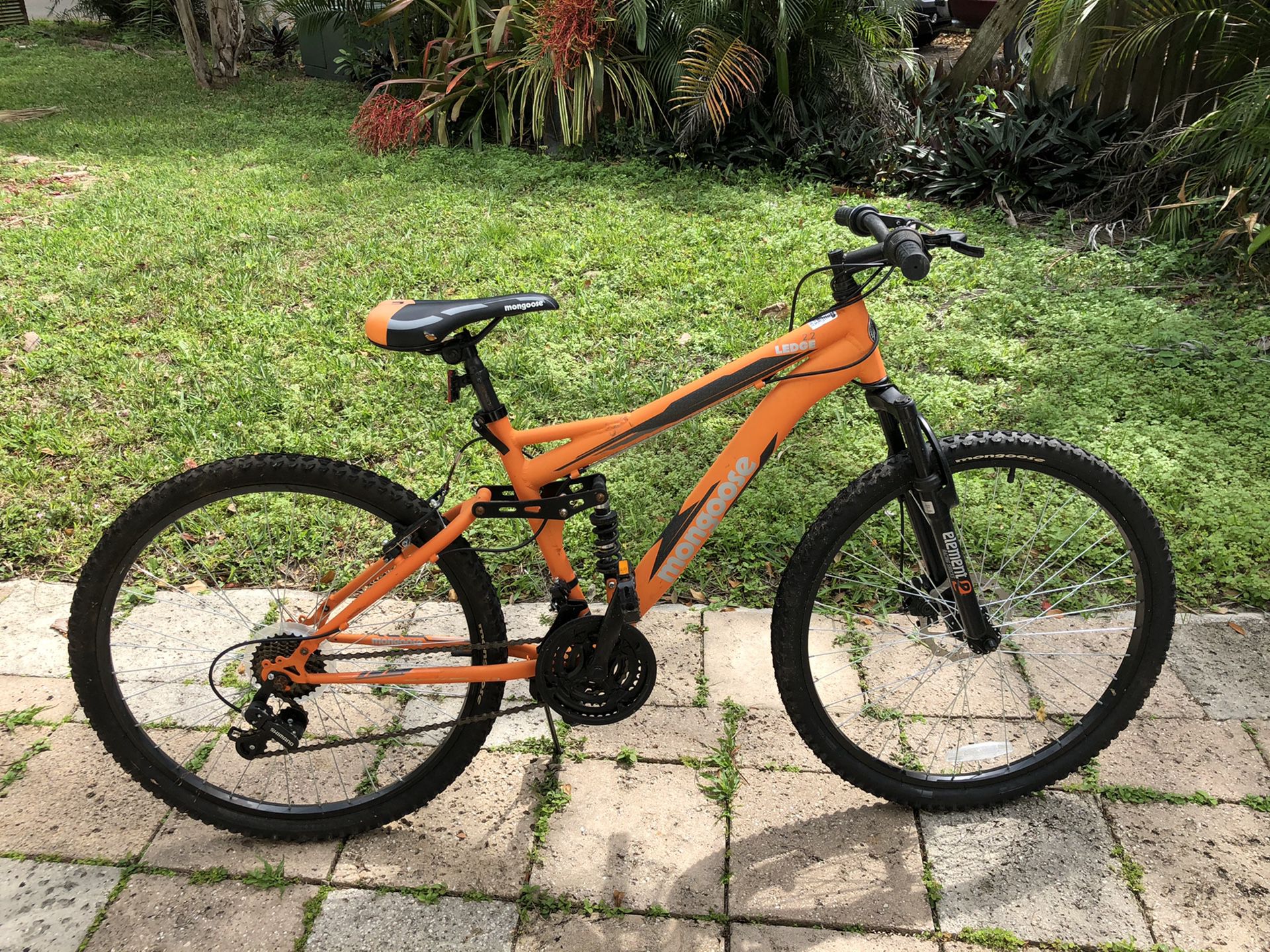 Orange and black mongoose mountain bike