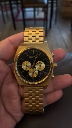 Men's Nixon black face watch