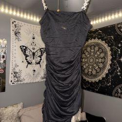 black ruched mini dress featuring rhinestone strap detailing, sold by Forever 21
