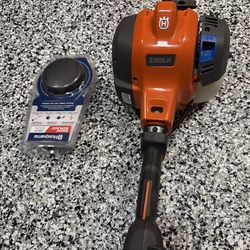 Husqvarna 330LK 28-cc 2-cycle 20-in Straight Shaft Attachment Capable Gas String Trimmer w/New Rapid Replace Trimmer Head