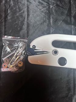 Handheld portable sewing machine