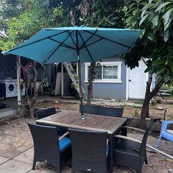 Old Table ,blue Umbrella, 2 Missing Cushions ,6 Seats,sturdy 