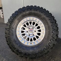 17" KMC rims w/ 35x12.50R17 Toyo MT Tires