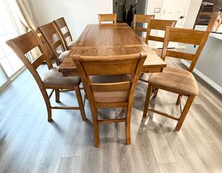 Dining table with eight chairs and small cabinet