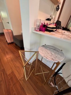 Two gold end tables