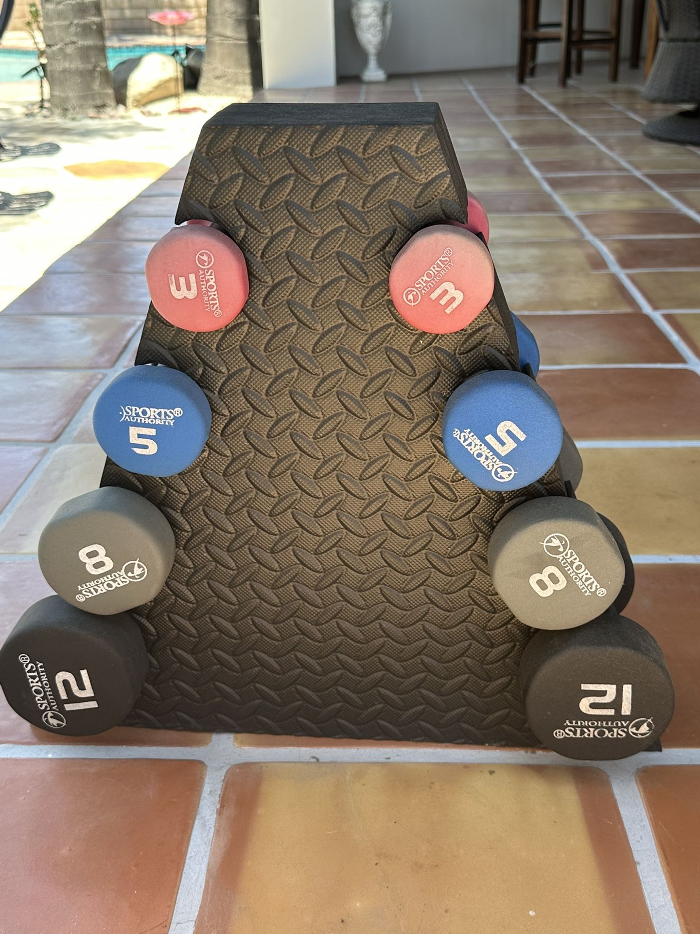 Neoprene Dumbells And Foam Romulus Stand