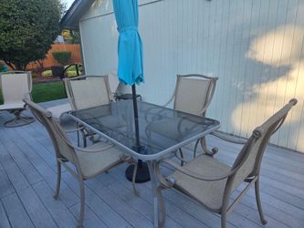 Patio glass table set with 4 chairs