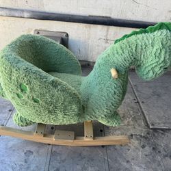 Plush green dinosaur rocking toy for kids